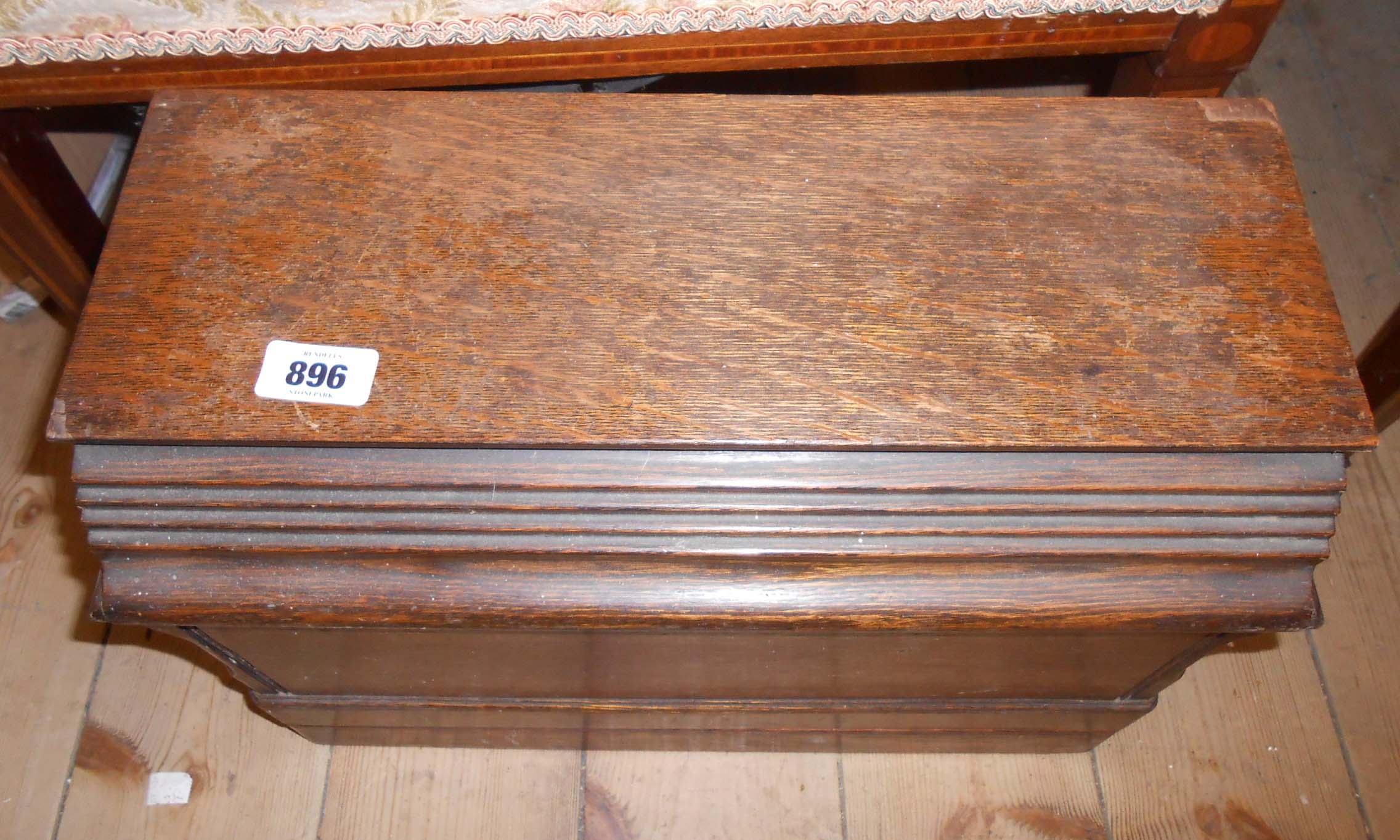 An old Singer sewing machine, in wooden case - sold with two similar uncased examples