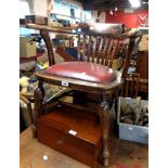 A vintage oak framed lathe back smoker's bow elbow chair with upholstered drop-in seat, set on