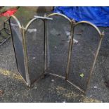 A brass framed and mesh fire guard