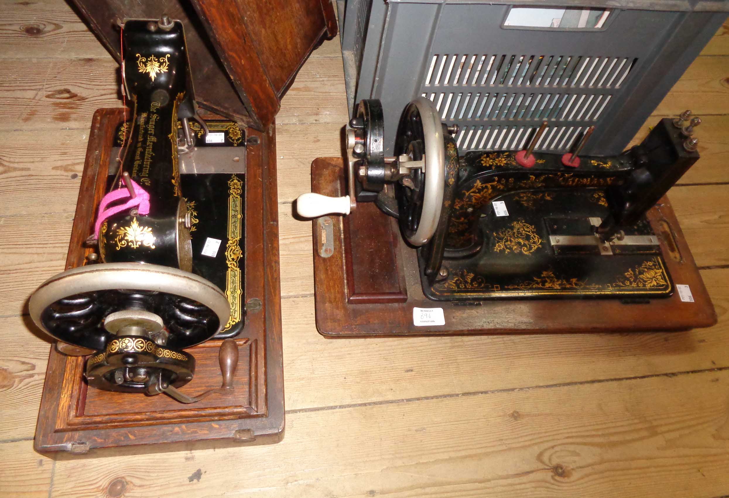 An old Singer sewing machine, in wooden case - sold with two similar uncased examples - Image 2 of 3