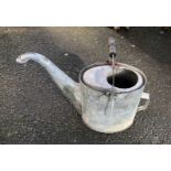 A vintage galvanised watering can