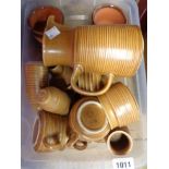 A box containing a quantity of Langley Stoneware teaware including teapot, cups, saucers, etc.
