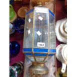 A North African hanging ceiling lantern with bevelled, coloured and textured glass panels in a brass