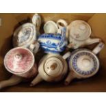 A box containing a quantity of pottery teapots including Wedgwood fallow deer, etc.