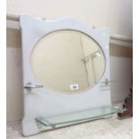 A vintage bathroom wall mirror with cup holder, toothbrush stand and glass shelf under, set on a