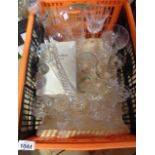 A crate containing a quantity of assorted glassware including drinking glasses, vases, etc.