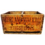 An old wooden bottle crate marked for Moorland Minerals, Kingsbridge