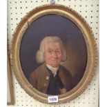An antique oval gilt framed oil on panel portrait of an 18th Century gentleman - with handwritten
