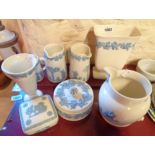A quantity of Wedgwood embossed Queensware including jugs, vases, lidded boxes, etc. - various