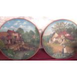 A pair of late 19th Century Watcombe terracotta wall plates, each decorated in oils with a Kate