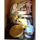 A box containing a quantity of ceramic items including figures, vases, etc.