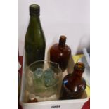 A small quantity of glassware comprising Victorian glass table rinser and assorted bottles including