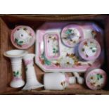 A small suitcase containing a Victorian porcelain dressing table set