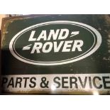 A modern reproduction printed tin Landrover Parts & Service sign