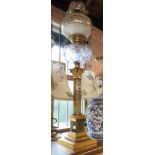A large late 19th Century Duplex burner oil lamp with onyx and ormolu column, clear glass chimney,