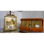 A Swiza heavy brass cased bracket style alarm clock - sold with a vintage Estima leather folding