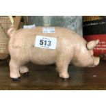 A modern painted cast iron money box of fat pig form