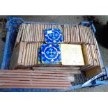 A crate containing a quantity of ceramic tiles