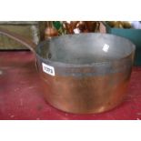 A Victorian copper saucepan with wrought iron handle and stamp mark for M. Paul