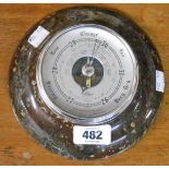 An 18.5cm diameter polished serpentine wall barometer with Shortland Brothers visible aneroid works