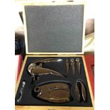A modern wine companion set comprising table corkscrew, stoppers, etc. in original lift-top