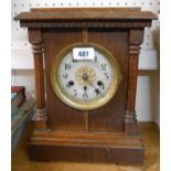 An early 20th Century German oak cased mantel clock with gilt centered dial and HAC eight day gong