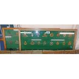 Two wooden display cases containing a large quantity of military cap badges including Duke of