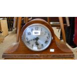 A 20th Century oak cased Napoleon hat mantel clock with eight day chiming movement