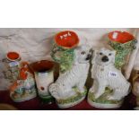 A pair of Victorian Staffordshire comforter spaniel spill vases, a Staffordshire figure depicting