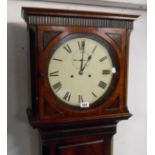 An antique flame mahogany long case clock with seconds dial to the 30cm diameter painted dial and