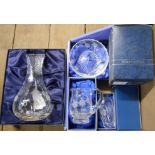 A box containing a quantity of boxed Stewart crystal items including vases, jugs, etc.