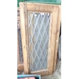 Three old pine doors with leaded glazed panels
