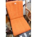 A retro acid orange tapestry upholstered boudoir chair, set on moulded splayed legs