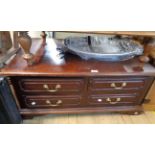 A 95cm reproduction mahogany coffee table with eight flanking short drawers, set on bracket feet