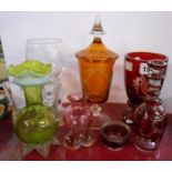 A small quantity of assorted coloured glassware including Bohemian amber flash cut cup and cover,