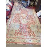 An Oriental twisted flat weave rug with central repeat motifs and all-over sprawling foliate