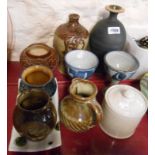 A quantity of studio and craft pottery including vases, jugs, etc.