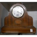 An Edwardian inlaid mahogany cased mantel timepiece with simple movement and key