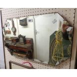 A vintage frameless canted oblong wall mirror with bevelled edges