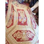 An Oriental twisted flat weave rug with European Classical style foliate scroll decoration on red