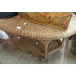 A 100cm John Lewis wicker oval topped two tier table, set on bound supports