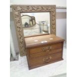 A gilt framed oblong wall mirror with decorative vine leaf border - sold with an Edwardian walnut