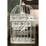 A modern set of three graduated painted metal birdcages
