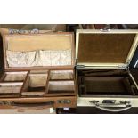 A vintage vellum covered fitted jewellery box of suitcase form with Harrods retailer stamp to