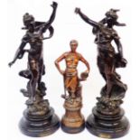 A pair of French spelter figures, each depicting a classical female figure with bronze effect finish