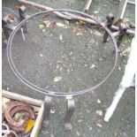 A pair of low wrought iron circular pot stands