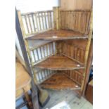 An antique bamboo three tier corner whatnot with slatted surfaces and stick back