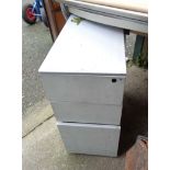 A metal three drawer filing chest