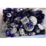 A crate containing a large quantity of blue and other glass cruet liners, cruet bottles, etc.