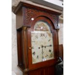 A 19th Century mahogany and oak longcase clock, with 32cm painted arched dial, blind fretwork